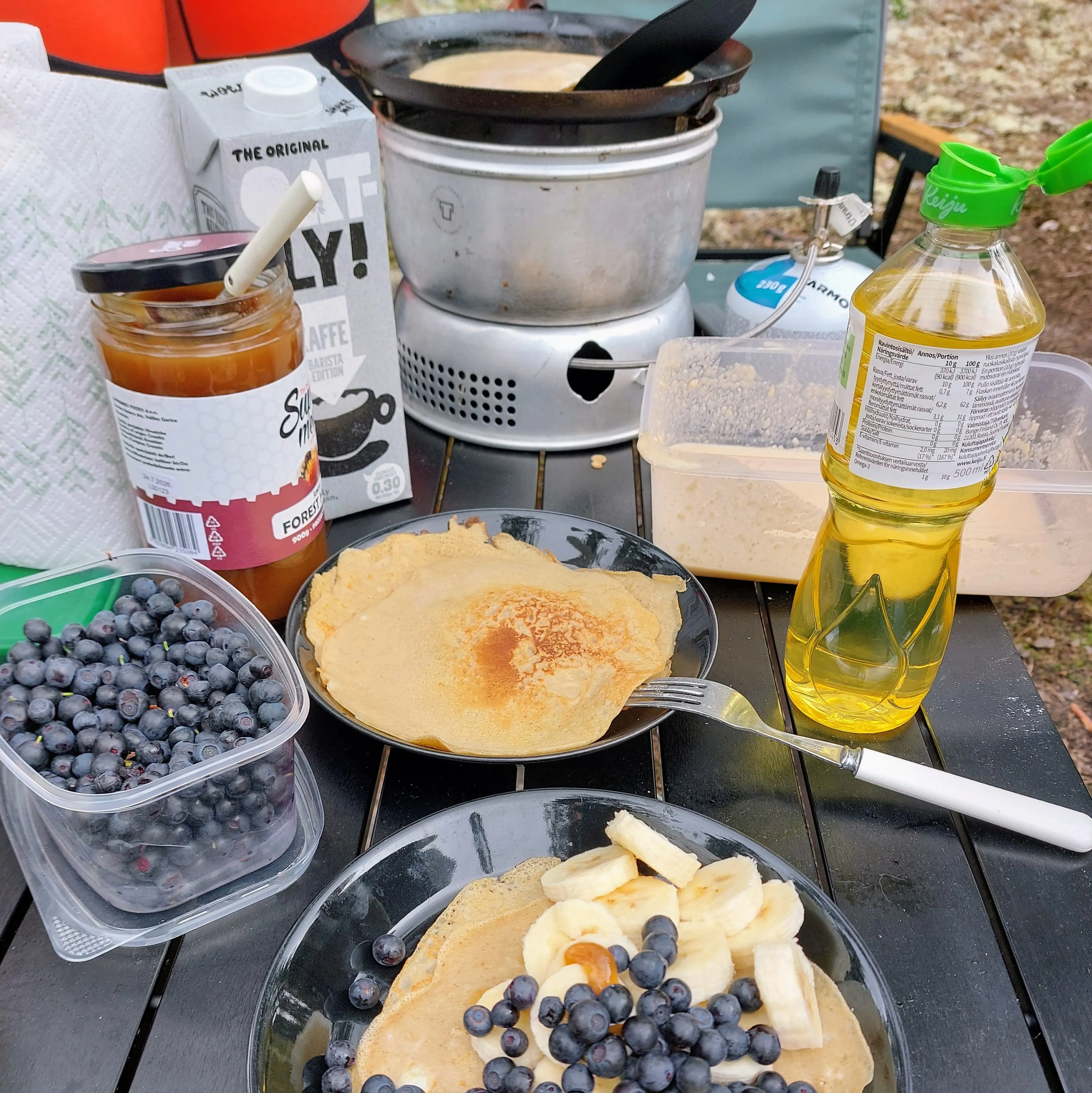 Camping kitchen with pancakes and blueberries
